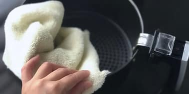 how to clean a air fryer: wash with a cloth