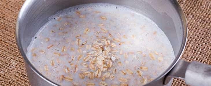 Cooking oatmeal porridge in a saucepan